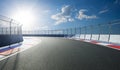 Racetrack with railing, afternoon scene