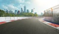 Racetrack with railing and city background