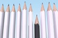 Racial discrimination concept. White pencils dominate black pencil Royalty Free Stock Photo