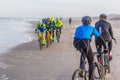 Racing bike competition riders in beach