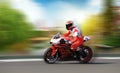 Racing bike rider racing at high speed on a colorful background Royalty Free Stock Photo
