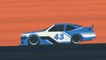 A blue racing car on a race track Royalty Free Stock Photo
