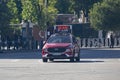 Racing car that opens the way to the runners of the half marathon that passes through the central streets of Madrid, in Spain.