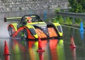 Racing car Radical SR4 sport prototype, during an uphill speed race in the rain