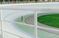 Racing cyclist on velodrome outdoor. Professional athlete in a yellow T-shirt does training on the velodrome. Background. Copy