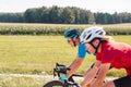 Racing cyclists couple riding in the countryside, tracking shot Royalty Free Stock Photo