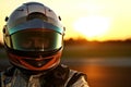 Racing driver in helmet and sportswear on blurred background Royalty Free Stock Photo