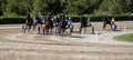 Racing horses trots on the track of stadium trotting horse racing competition