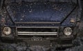 Racing on off-road cars. Lights and bonnet covered with mud. Part of car stuck Royalty Free Stock Photo