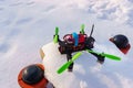 Racing quadcopter on the snow Royalty Free Stock Photo
