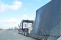 Racing Vehicle Being Hauled By Semi Truck