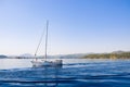 Racing yacht in the sea on blue sky background. Peaceful seascape. Beautiful blue sky over calm sea. Royalty Free Stock Photo