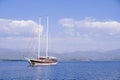 Racing yacht in the sea on blue sky background. Peaceful seascape. Beautiful blue sky over calm sea. Royalty Free Stock Photo