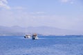 Racing yacht in the sea on blue sky background. Peaceful seascape. Beautiful blue sky over calm sea. Royalty Free Stock Photo