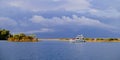 Racing yacht in the sea on blue sky background. Peaceful seascape. Beautiful blue sky over calm sea. Royalty Free Stock Photo