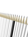 Racism concept black pencil among white pencils