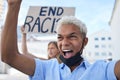 Racism, covid protest and man with cardboard poster and shout in street with face mask during pandemic. Frustrated human Royalty Free Stock Photo