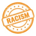 RACISM text on orange grungy vintage round stamp