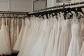 a rack of aline wedding dresses in a clean store setting Royalty Free Stock Photo