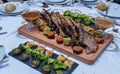 A rack of barbecue Veal ribs with barbecue sauce and sides of potatoes, cauliflower, and broccoli Royalty Free Stock Photo