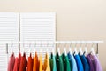 Rack with bright clothes in room Royalty Free Stock Photo