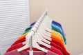 Rack with bright clothes in room Royalty Free Stock Photo