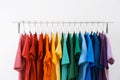 Rack with bright clothes on white background Royalty Free Stock Photo