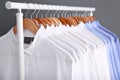 Rack with clean clothes on hangers Royalty Free Stock Photo