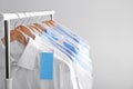 Rack with clean clothes on hangers after dry-cleaning Royalty Free Stock Photo