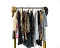 Rack with coat hanger with smart beautiful women`s holiday dresses in rhinestones and sequins. Preparing for event, public