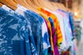 A rack of colorful shirts hanged for sale at local market Royalty Free Stock Photo