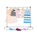 Rack with colorful summer children clothes hanging on hangers Royalty Free Stock Photo