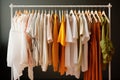 Rack with different stylish clothes. Capsule
