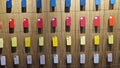 A rack displaying bumpers of different colors for iPhone phones