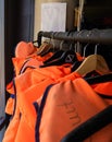 Rack of emergency floating jackets on hangers Royalty Free Stock Photo