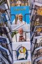 Rack filled with postcards and booklets with photos of Pope Francis` smiling face.