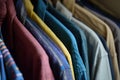 a rack full of various kinds of shirts