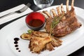 Rack of lamb with oyster mushrooms and vegetables Royalty Free Stock Photo