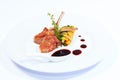 Rack of lamb with sauce and vegetables Royalty Free Stock Photo