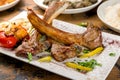 Rack of lamb on white plate with vegetalbes close up Royalty Free Stock Photo