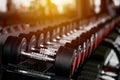 Rack with many different sizes of dumbbells in the gym Royalty Free Stock Photo