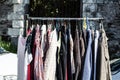 Rack of old fashioned women's clothes at garage sale