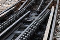 Cog railway tracks with an additional toothed rack located in the middle of the track to overcome large tilts.