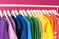 Rack with rainbow clothes Royalty Free Stock Photo