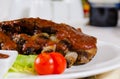 Rack of Saucy Barbecue Pork Ribs on Plate