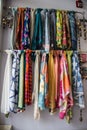 A rack of scarves on display in a store