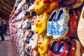 Rack in the store with rows traditional dutch wooden shoes - klompen clogs