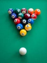 Rack a table for pool with spots and stripes balls. Mini billiard, vertical format Royalty Free Stock Photo