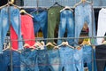A rack of a variety of blue jean in market