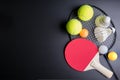 Racket table tennis, ping pong ball, Shuttlecocks, Badminton racket and Tennis ball on black background.Sport concept, Copy space